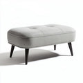 Grey fabric ottoman with tufted design and black wooden legs 75 x 40 x 40cm