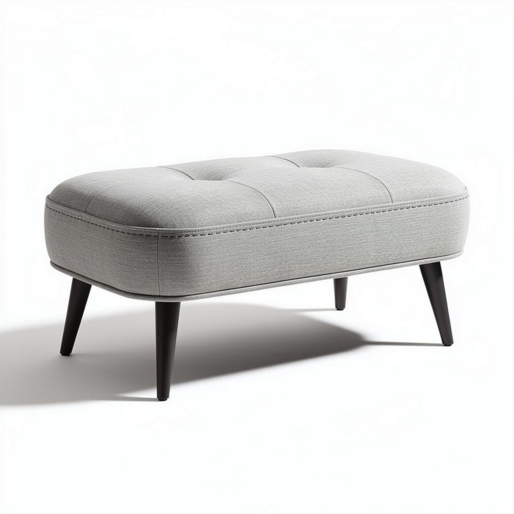 Grey fabric ottoman with tufted design and black wooden legs 75 x 40 x 40cm